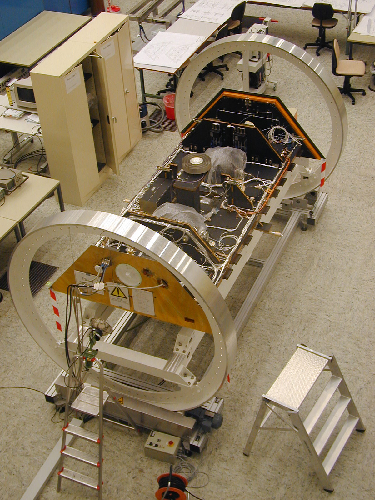 One of the twin GRACE spacecraft is seen during construction in Germany.